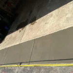 Polyjacking for garage aprons close gaps and stop tires from dropping